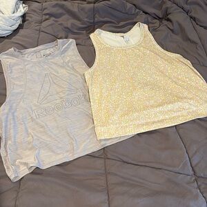 Pair of Reebok workout tops. Medium